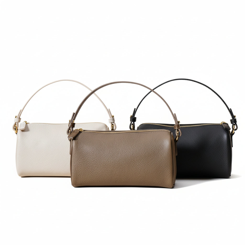 Three handbags in white, beige, and black on a light beige background