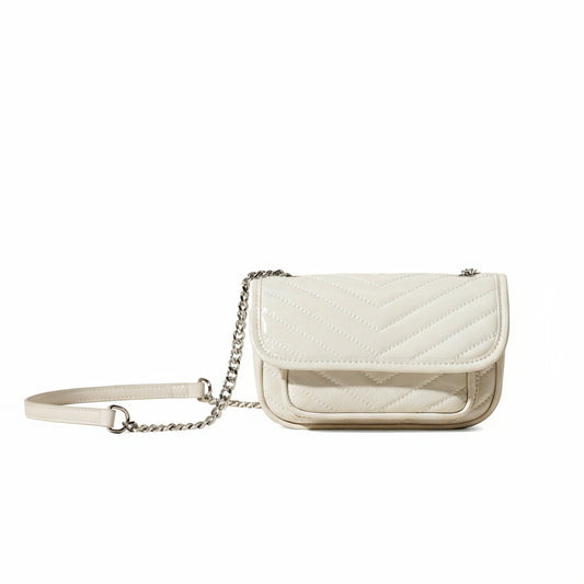 White quilted handbag with a chain strap on a beige background