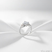Silver ring with a diamond on a white fabric background | Velanci Womens Ring