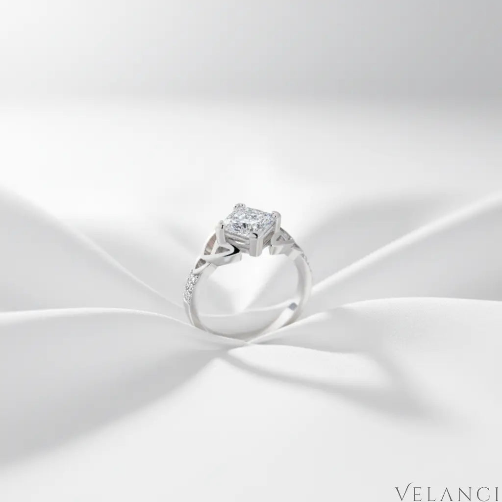 Silver ring with a diamond on a white fabric background | Velanci Womens Ring
