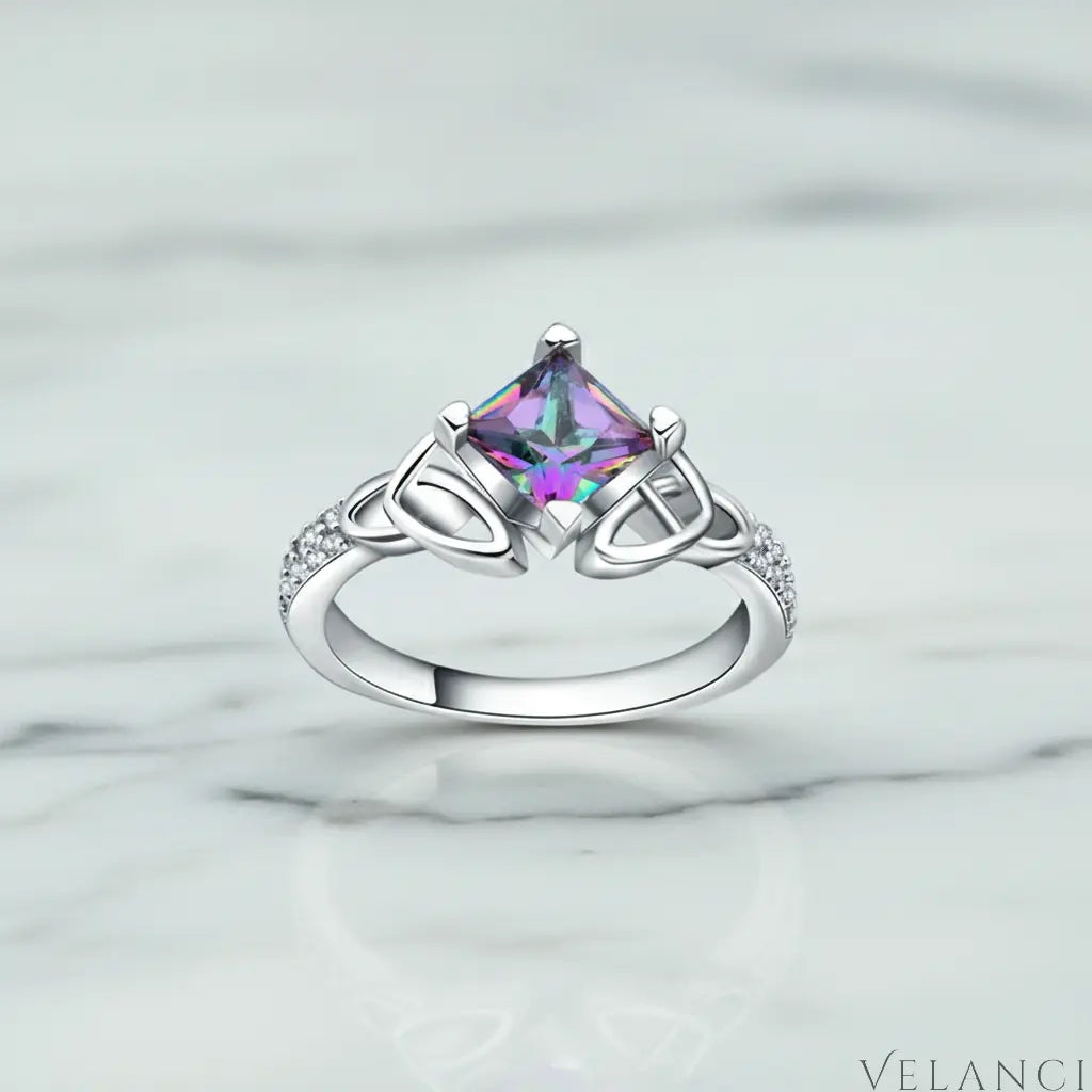 Silver ring with a colorful gemstone on a light gray background | Velanci Womens Ring