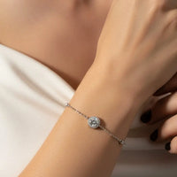 Close-up of a hand wearing A Silver bracelet with diamond-like stones