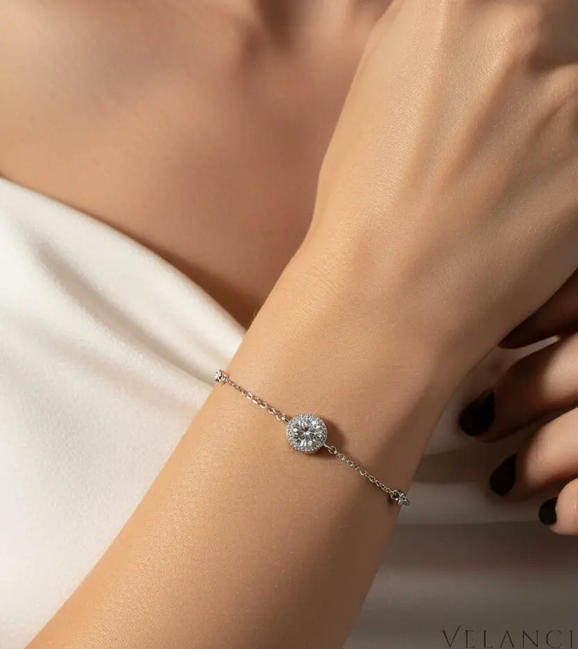 Close-up of a hand wearing A Silver bracelet with diamond-like stones