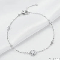 Silver bracelet with a heart clasp on a light gray background